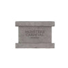 A rectangular gray collectible figure with the text MONSTERS CARNIVAL and MIRONO engraved on the front.