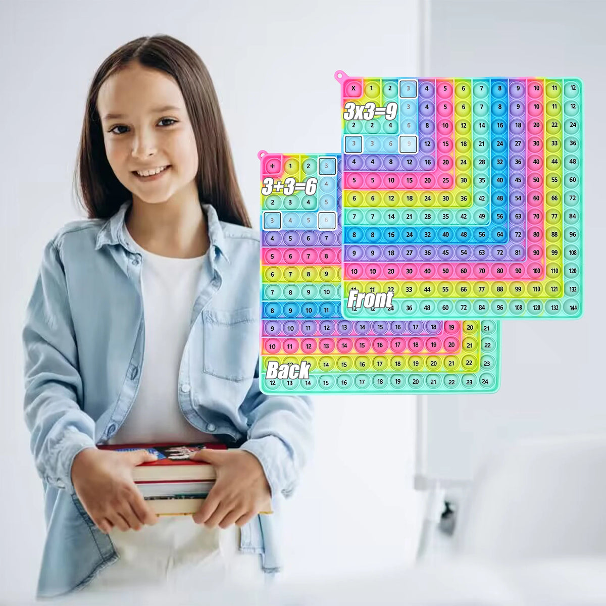 A girl smiling while holding a set of colorful multiplication and addition fidget toys for kids.