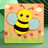 A wooden puzzle set featuring a yellow bee cutout on a light orange background with green foliage.