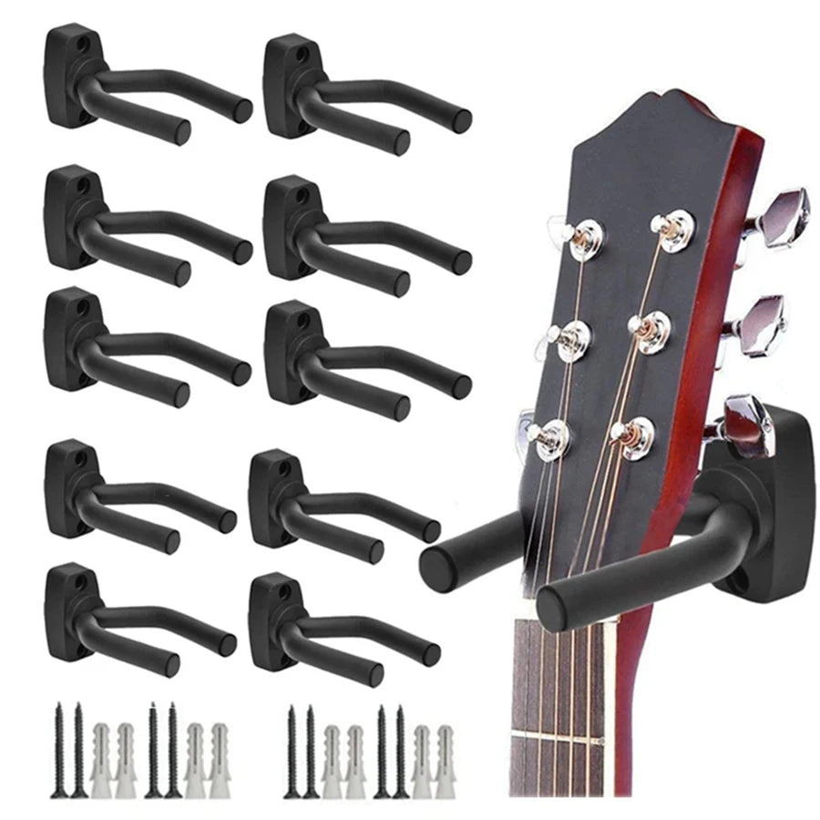 A set of black wall-mounted guitar holders and tuning pegs for mounting guitars.