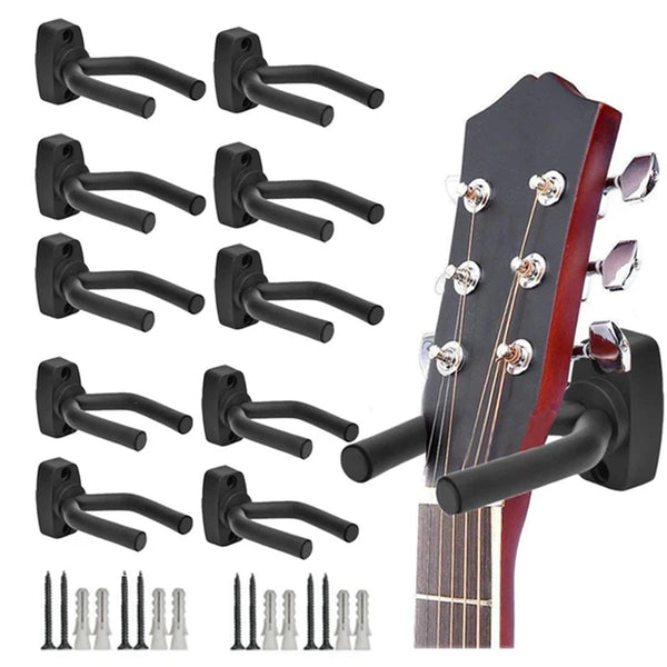 A set of black wall-mounted guitar holders and tuning pegs for mounting guitars.