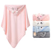 A pink hooded animal bath towel featuring a cat design, next to stacked towels.