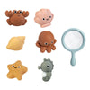 A set of five silicone bath toys shaped like sea creatures including a turtle, a clam, a starfish, an octopus, and a gray ele