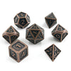 A set of ten metal polyhedral dice with a bronze finish scattered on a white background.