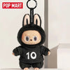 A black plush toy resembling a rabbit with large ears and a stitched mouth, featuring the number 10.