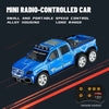 A blue mini radio-controlled pickup truck with yellow accents and a remote control visible against a dark background.