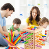 A wooden stacking tower game with colorful rods and balls is shown in a family interaction setting.