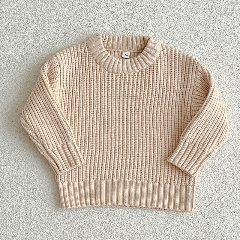 A light beige knit baby pullover sweater for boys and girls shown flat lay.