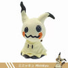 A soft plush toy of Mimikyu, a Pokémon, with black tips on its ears and face.