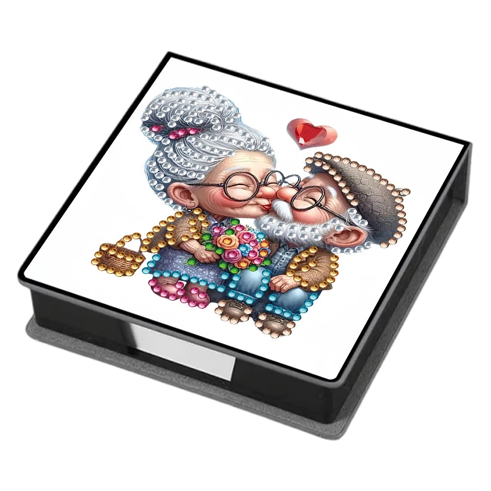 A painting kit featuring an illustration of a smiling, elderly man with a beard and glasses on a black box.
