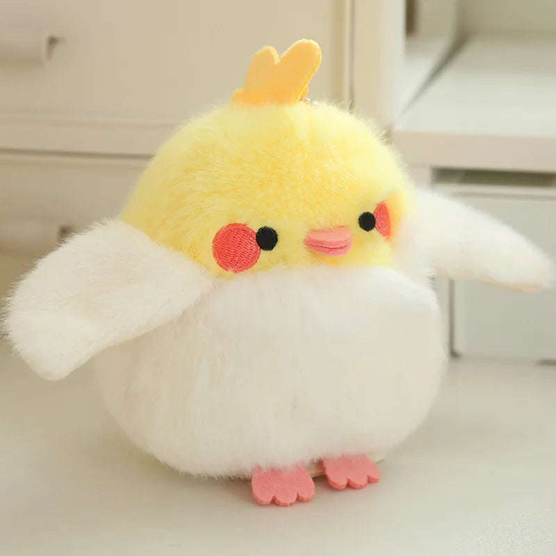 A fluffy yellow and white cartoon bird plush with pink accents.