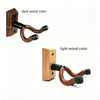 A dark wood guitar wall mount with a rotating U-shaped hanger shown in two color options: dark wood and light wood.