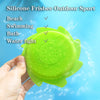 A hand holds a bright green silicone frisbee toy designed for outdoor sports, swimming, and bath play.