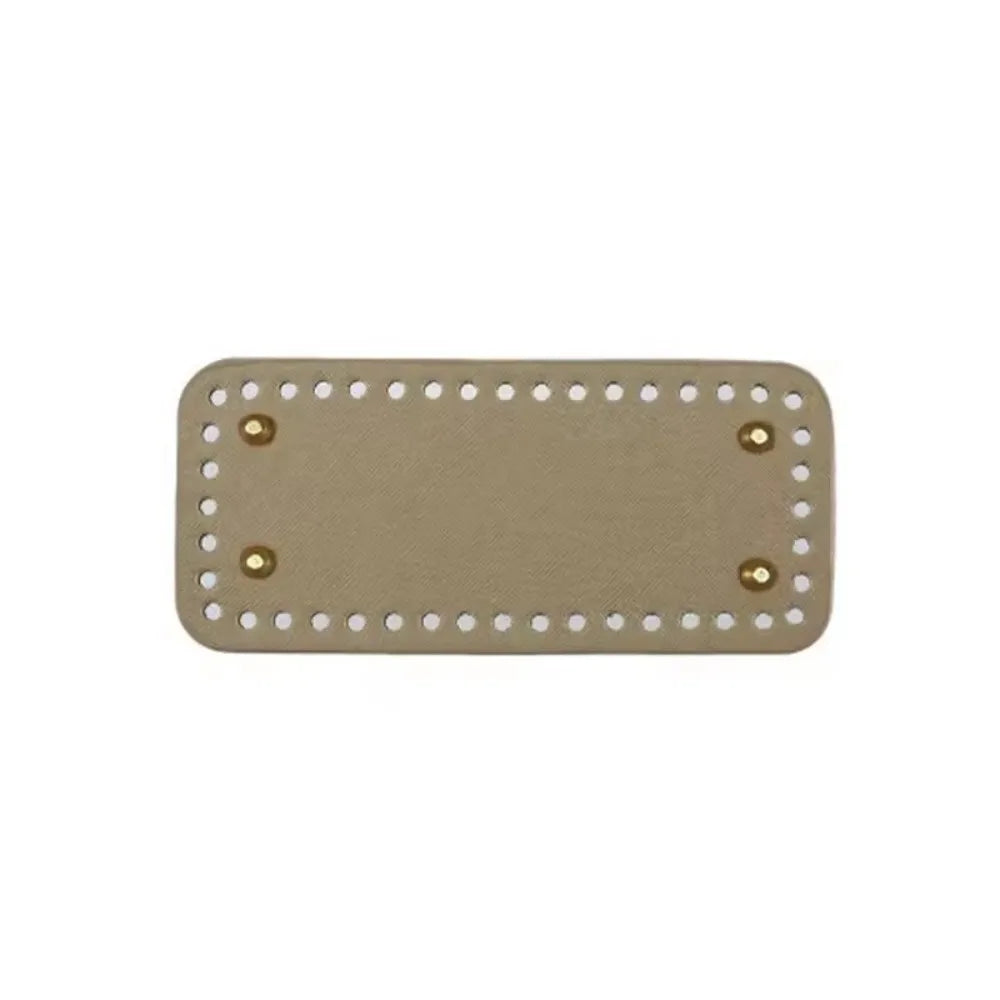 A rectangle shaped PU leather crochet bag bottom with pre-punched holes in a beige color.