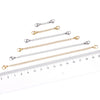 Multiple stainless steel extension chains with lobster clasps shown against a ruler for size reference