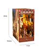 A wooden book nook kit featuring a detailed scene with warm LED lighting and architectural elements.