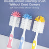A set of three double-ended cleaning brushes in pink, blue, and yellow for efficient cleaning.