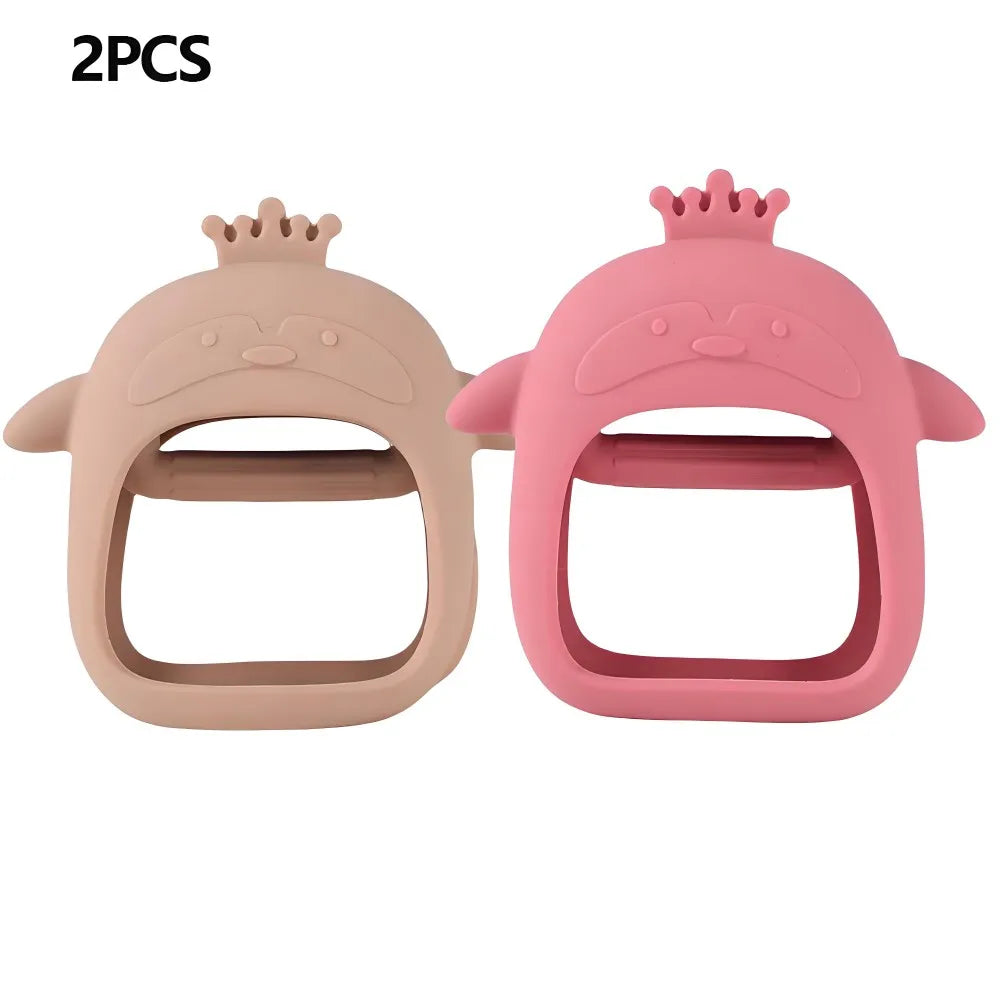 Two pink silicone teethers shaped like heads for babies