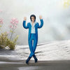 A plush doll of Elvis Presley Cat King in a blue suit standing on a snowy surface.