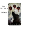 A tarot card featuring a black cat and three blood-like moons on a dark background.