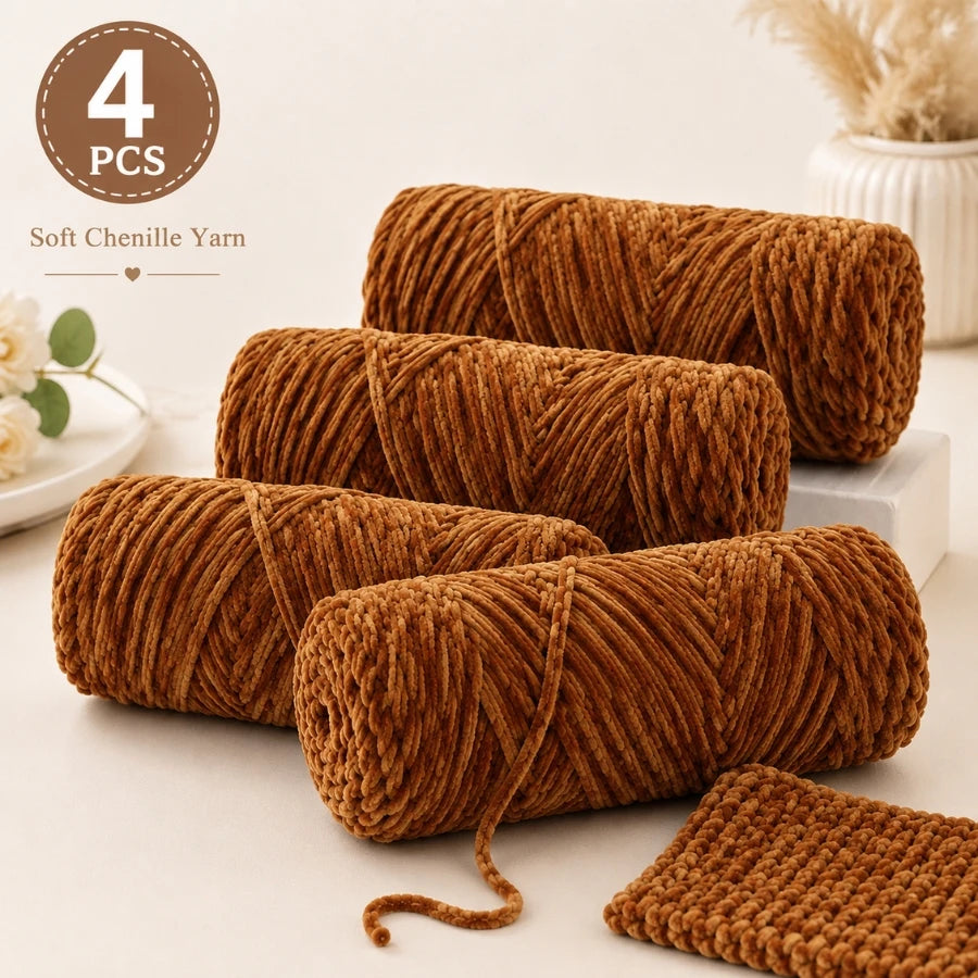 Four spools of brown soft chenille yarn for crochet and knitting projects.