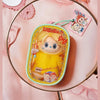 A yellow hair salon series doll bag pendant keychain featuring a character with blonde hair and pink accents.