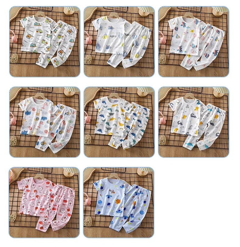 A set of children's cotton pajamas featuring various colorful patterns and designs for boys and girls.