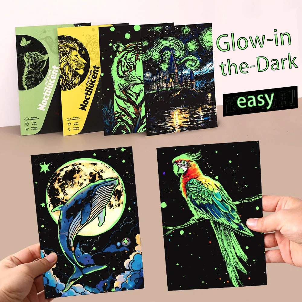 A collection of glow-in-the-dark scratch art cards featuring animals and celestial themes.