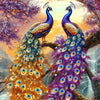 Two vibrant peacocks with iridescent blue and purple feathers standing on a tree branch against a colorful sunset background.