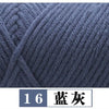 A close-up view of dark gray premium milk cotton yarn used for knitting or crafting.