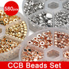 A set of 580 gold and silver plated beads for jewelry making, packaged in clear compartments.