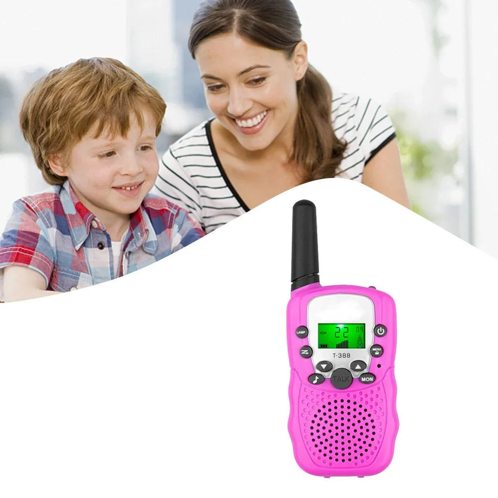 A pink mini walkie talkie set for kids is shown with a smiling woman and a child in the background.