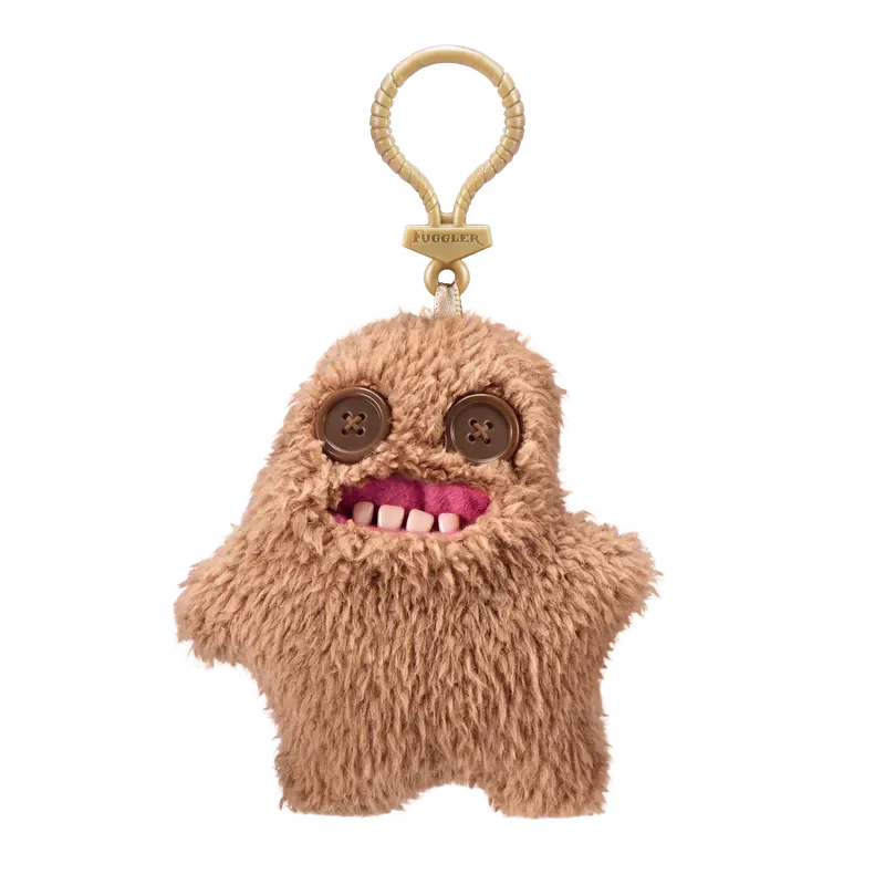 A fluffy brown plush monster keychain with large eyes and a smiling mouth.