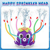 A purple octopus water sprinkler head spraying water in various directions.