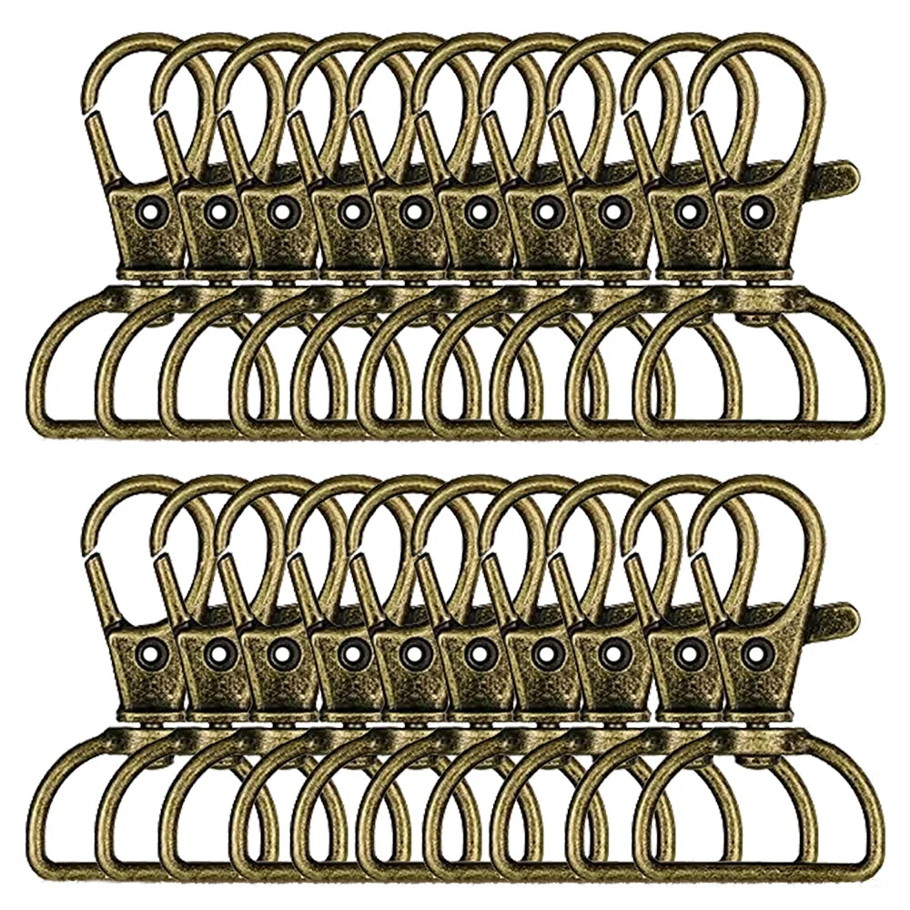 A set of 30 swivel snap hooks with D-rings shown in a brass or antique gold color.