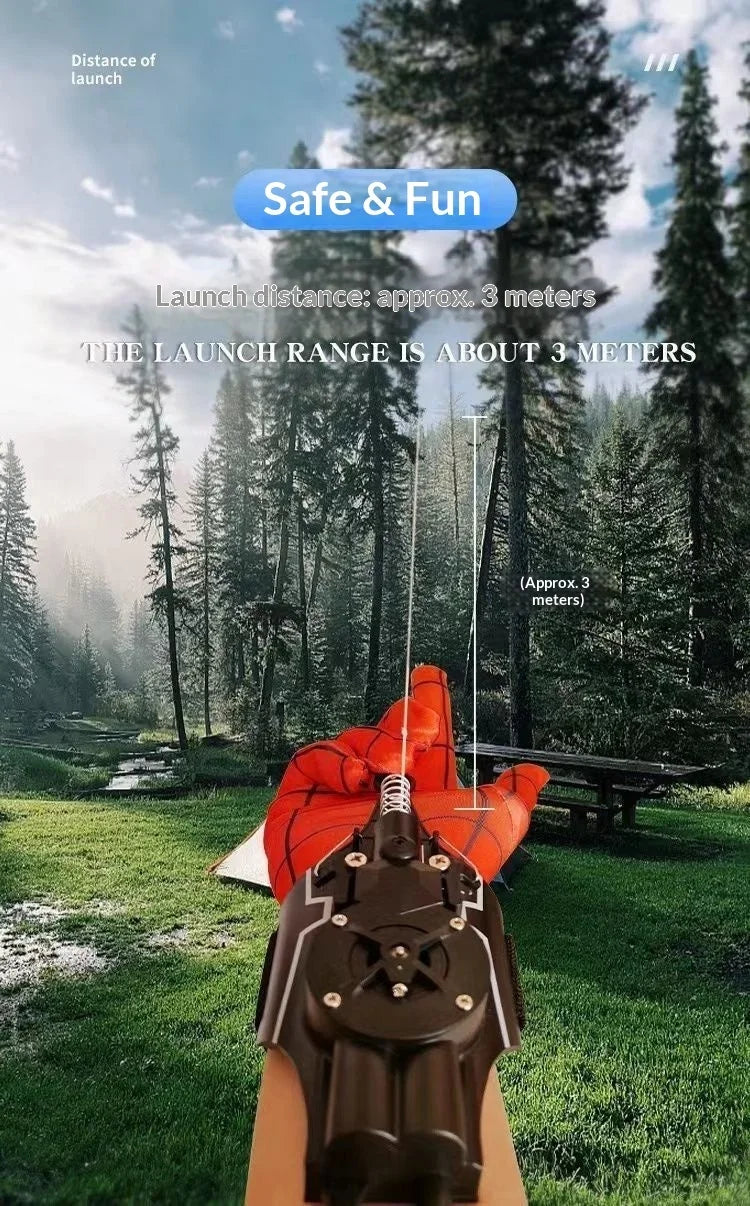 An electric auto-retractable wrist-mounted web shooter is shown in close-up against a backdrop of a forest and fog.