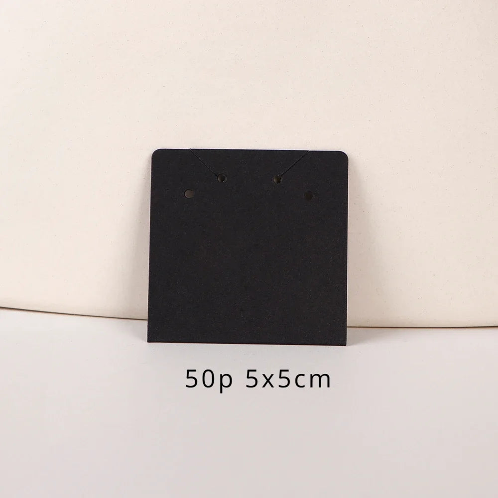 A black square jewelry display card is shown against a light background, with dimensions noted as 50p 5x5cm.