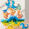 A stack of wooden dinosaur blocks in various shades of blue and orange, used as a Montessori balance toy.