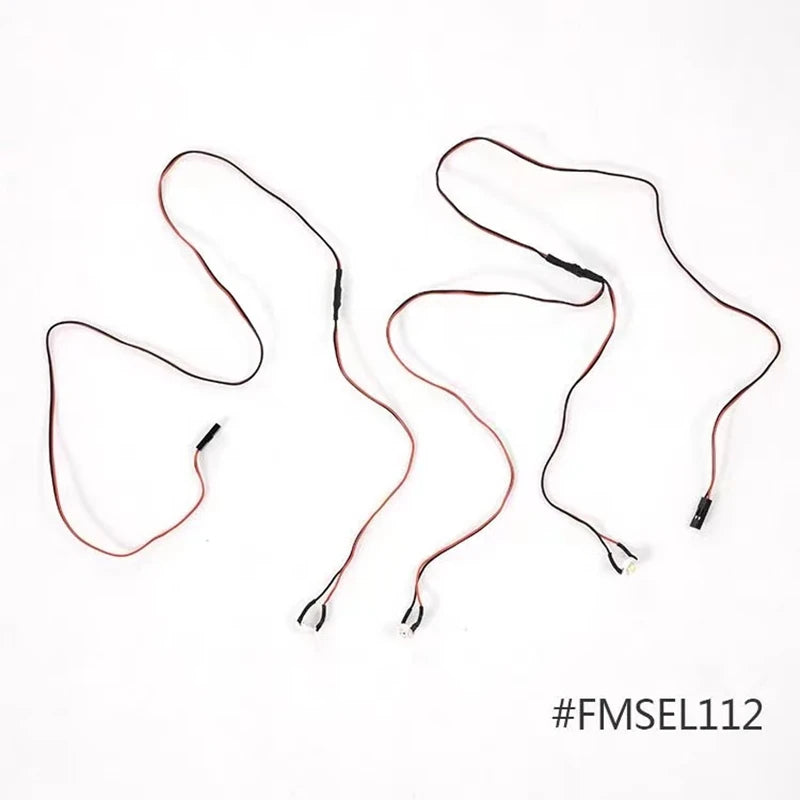 A set of thin, reddish-brown wires used for replacement parts in an RC airplane kit.