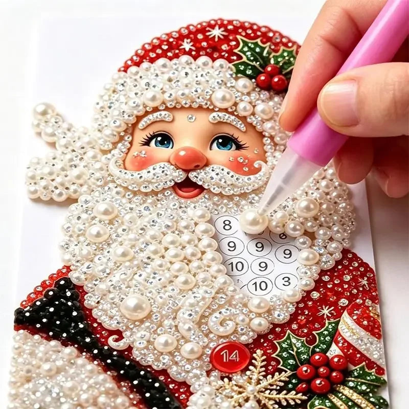 A hand applies pearl art to a Christmas ornament featuring a bearded man and festive red and green details.