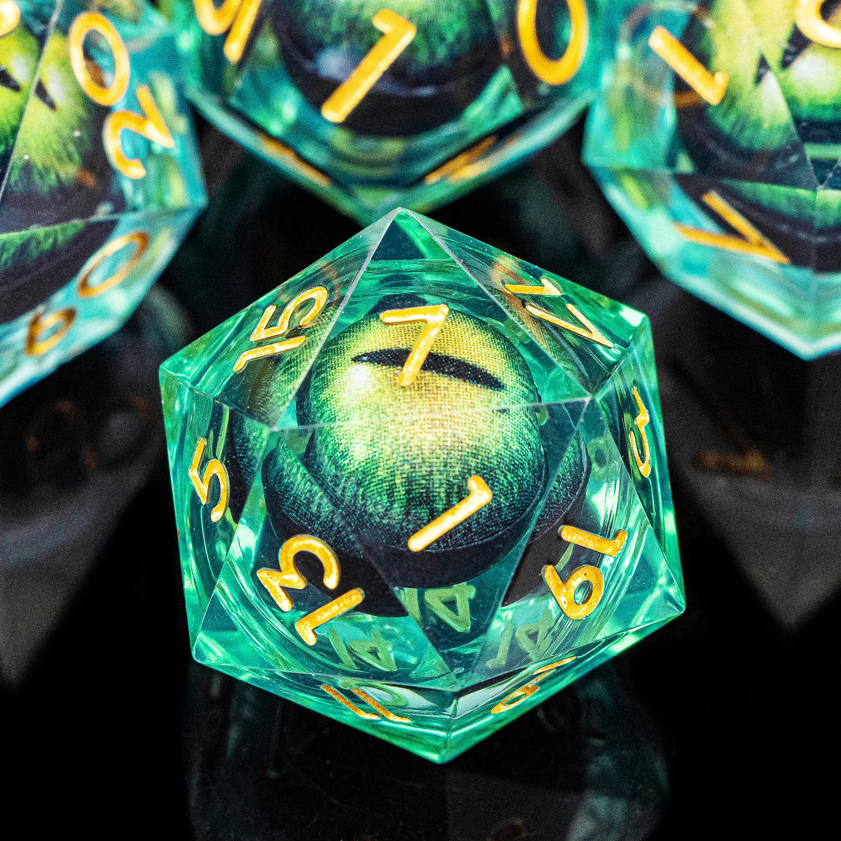 A close-up of a green liquid core resin die with the number 7 visible, surrounded by other polyhedral dice.