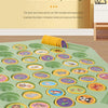 A green silicone memory matching game with various animal-themed discs for baby's hands.