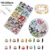A collection of 100-200 spacer beads in various colors and styles for jewelry making, including round, flat, and decorative s