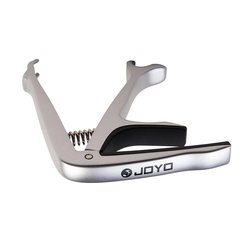 Silver zinc alloy guitar capo with a black body and a silver spring mechanism