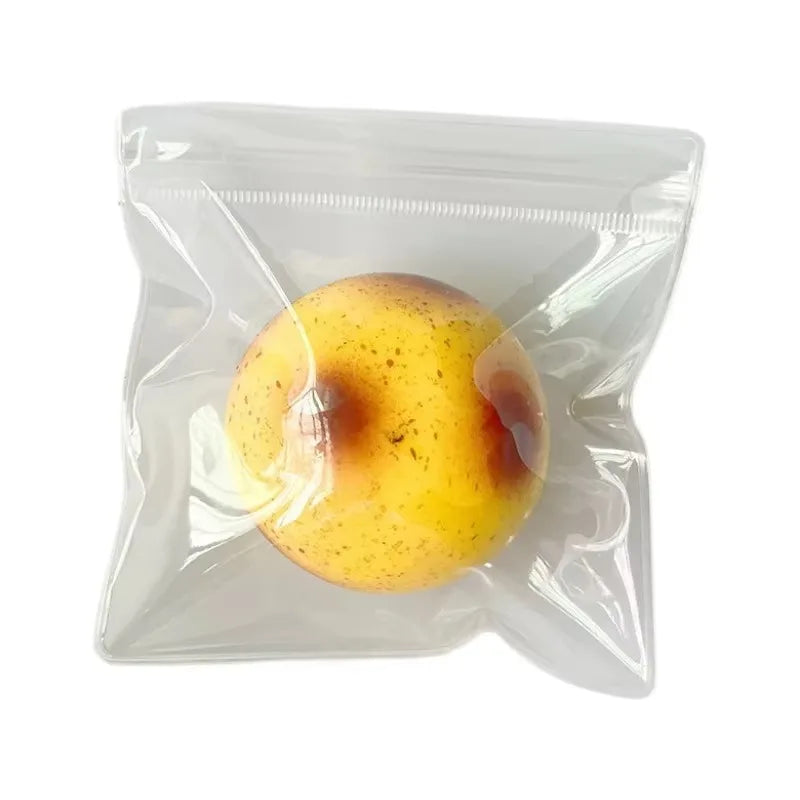 A yellow, slightly bruised apple is visible inside a clear plastic bag.