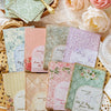 A collection of vintage paper sheets featuring floral and nature designs for journaling and scrapbooking