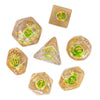 A set of polyhedral dice with a mushroom theme, featuring translucent amber and green colored dice.