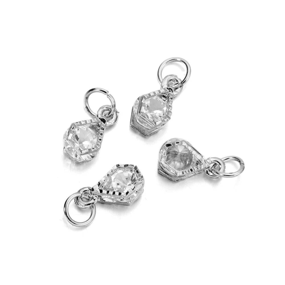 A set of silver rhinestone heart charms for jewelry making, featuring a bail and a decorative heart shape.