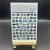 A vertical display of cute decorative stickers featuring animals, music notes, hearts, and various icons on a clear sheet.