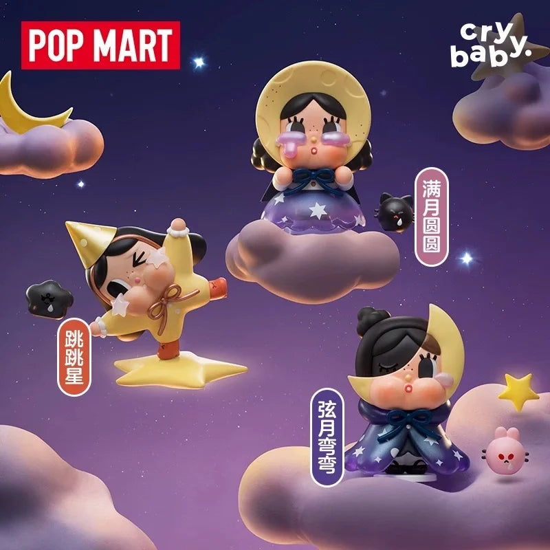A collection of Crybaby figurines featuring characters with large eyes and purple accents floating in a starry, cloudy night 